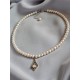 Collier tour de cou perles de culture et amulette pendule pierre de lune